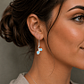 Silver dangle earrings with blue topaz