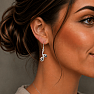 Silver dangle earrings with mystical topaz