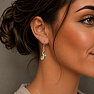 Silver dangle earrings with olivine