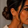Silver dangle earrings with blue topaz