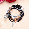 A set of five fashionable bracelets in a unisex black tone