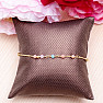 Chain bracelet with pink and green cut glass beads