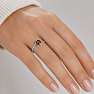Silver ring with brownish hue