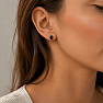 Silver earrings with a brownish hue